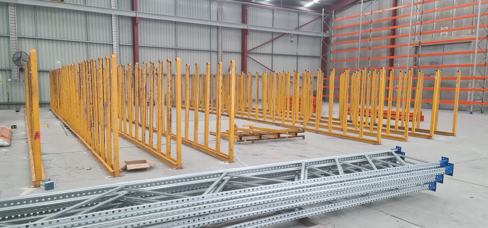 Warehouse Relocation 2 Racking being carefully dismantled for relocation — showing the process and the condition assessment context