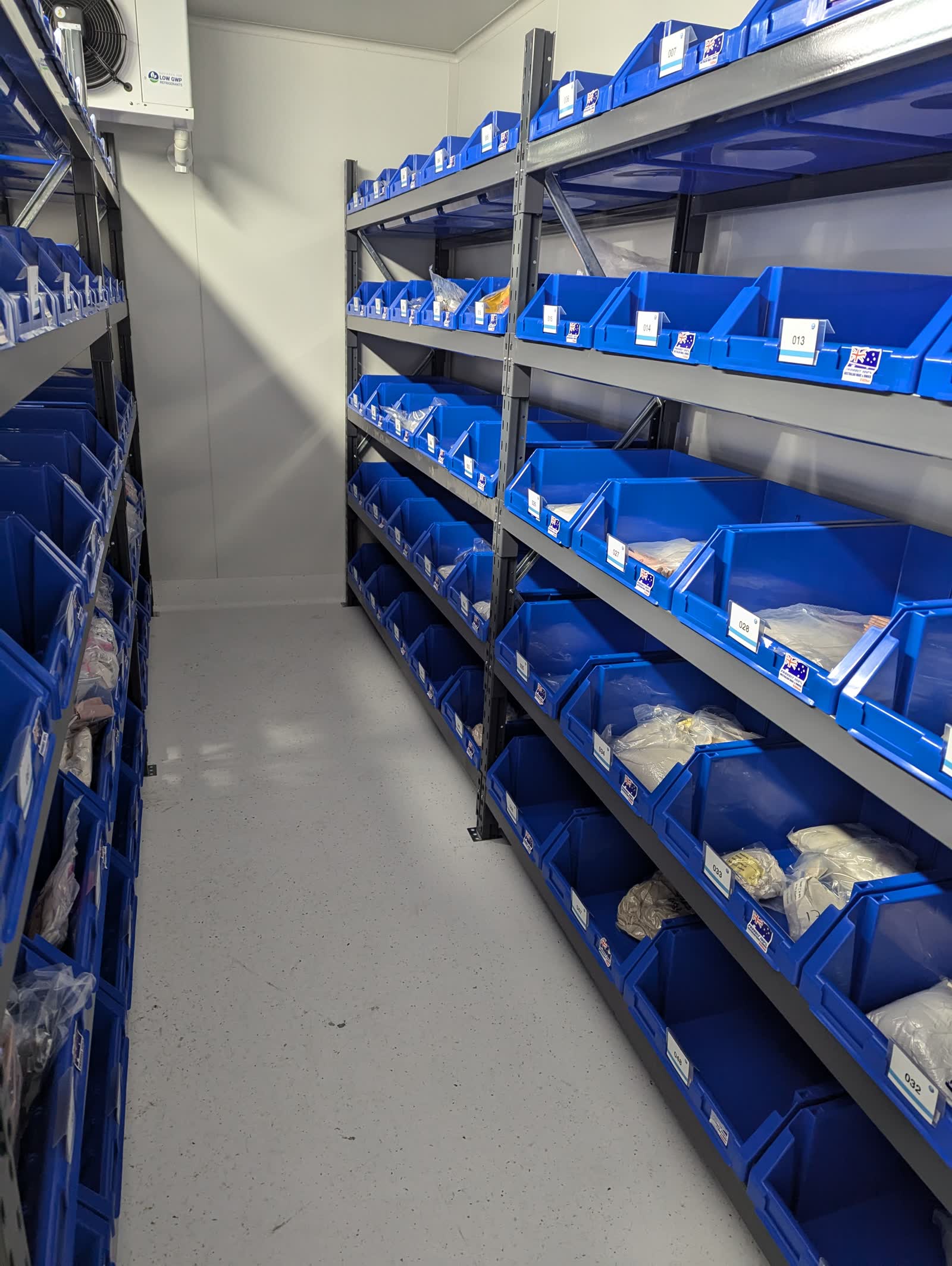 Picking aisle in use — shows realistic operational picking context, not a staged empty aisle